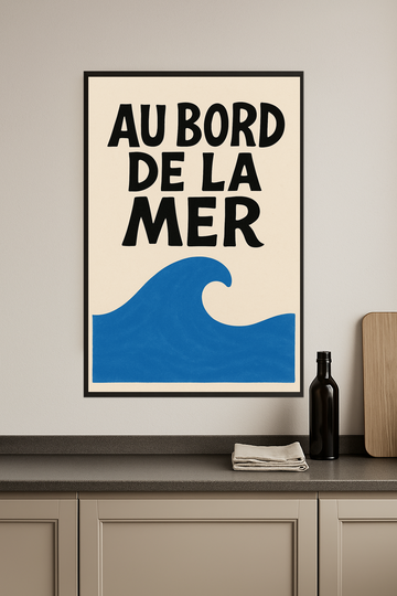 Stylized text 'AU BORD DE LA MER' above a blue wave shape.- kuchnia