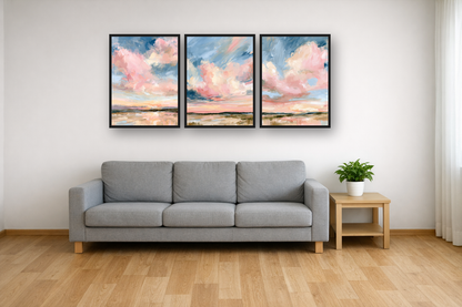Powder Clouds framed poster set above a sofa in a living room